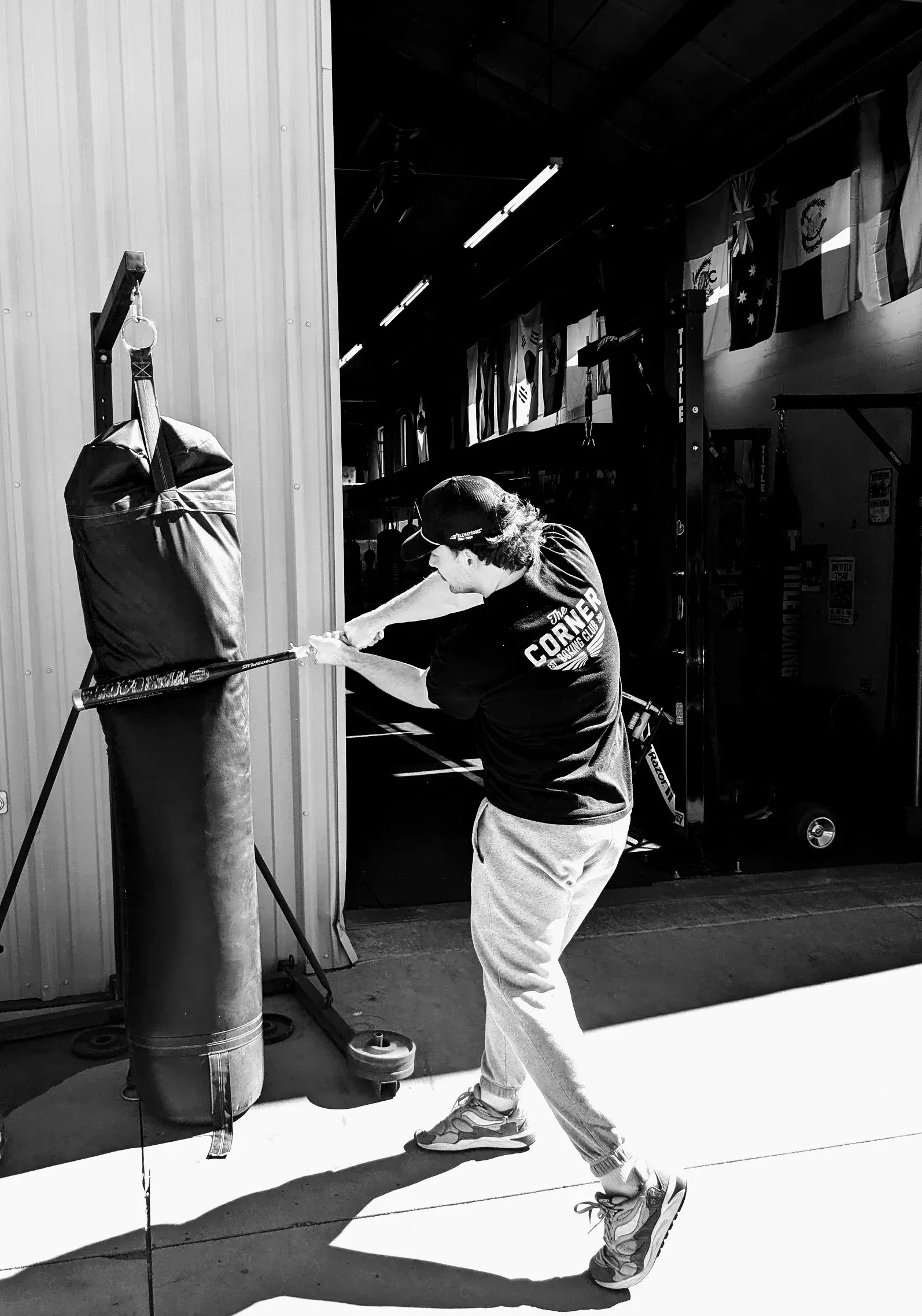 A boxer working the heavy bag at The Corner