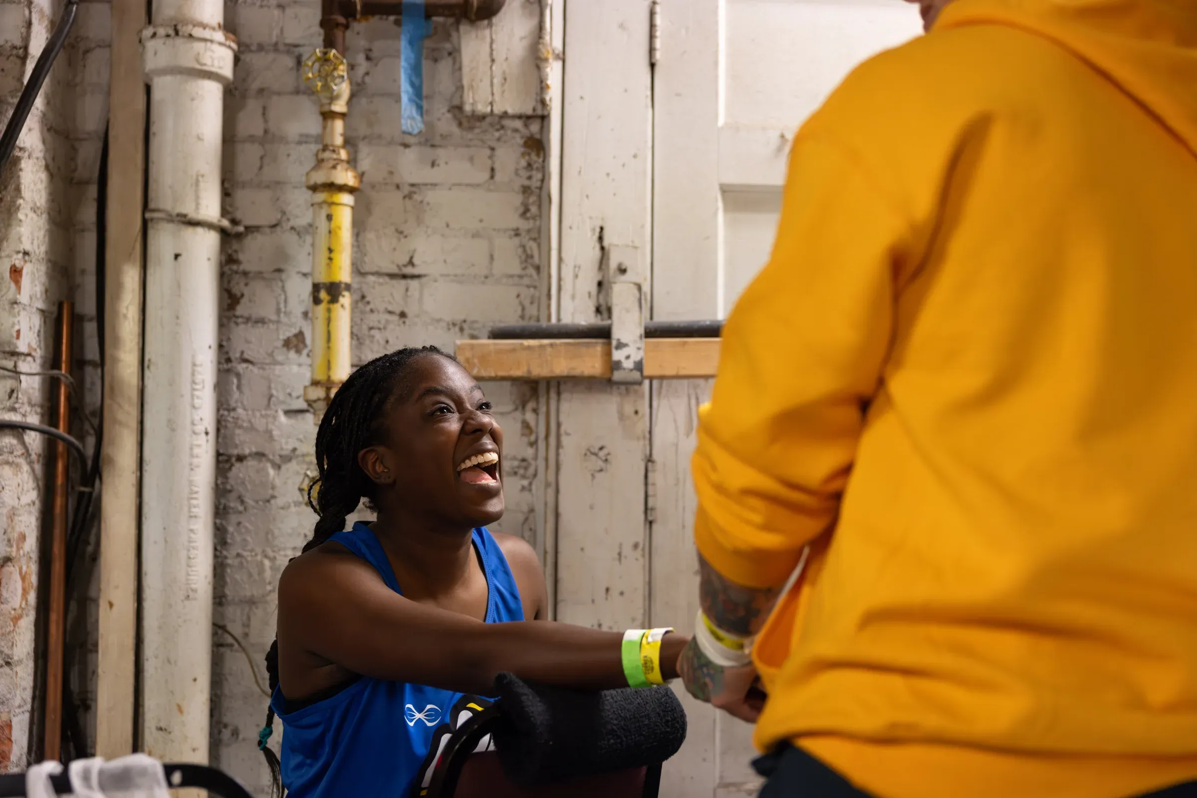 A Unite to Fight boxer in her corner between rounds